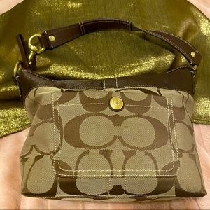 Coach hand bag, super cute & priced to sell! small stain, on bottom of purse.